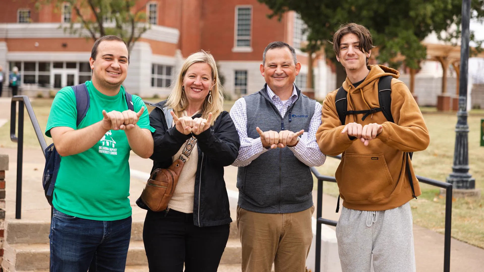 OBU community members flash the Bison sign ahead of The Weekend, Oct. 1-3, when Bison Hill welcomes back generations of alumni, students and families for Homecoming, Family Weekend and Bison Day.